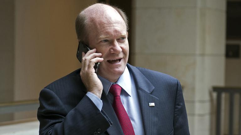 Chris Coons - Senate Foreign Relations Committee member Chris Coons, D-Del., talks on a phone as he leaves briefing on the Administration’s response to the Syrian conflict, in a closed session in Washington, Tuesday, Oct. 27, 2015. (AP Photo/Cliff Owen)