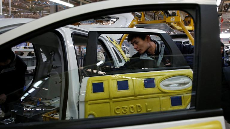 FILE PHOTO: An employee works on an assembly line producing electronic cars at a factory of Beijing Electric Vehicle, funded by BAIC Group, in Beijing - FILE PHOTO: An employee works on an assembly line producing electronic cars at a factory of Beijing Electric Vehicle, funded by BAIC Group, in Beijing, China, January 18, 2016.REUTERS/Kim Kyung-Hoon/File Photo                      GLOBAL BUSINESS WEEK AHEAD - NARCH/NARCH30