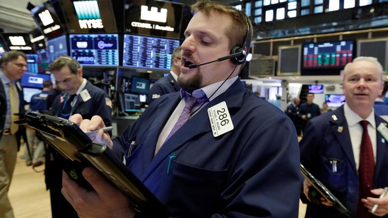 Michael Milano - Trader Michael Milano, center, works on the floor of the New York Stock Exchange, Monday, April 9, 2018. Stocks are opening solidly higher on Wall Street, led by gains in big technology companies. (AP Photo/Richard Drew)