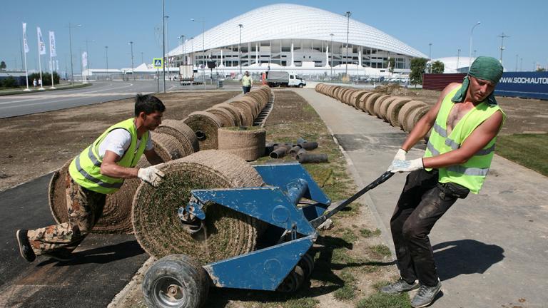 Employees place layers of lawn outside the Fisht Stadium in Sochi - Employees place layers of lawn outside the Fisht Stadium in Sochi, the host city for the 2018 FIFA World Cup, Russia May 16, 2018. REUTERS/Kazbek Basayev