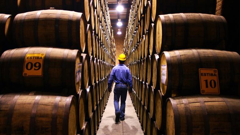 "Patron Distillery" employee reviews tequila barrels during the process of production of tequila in Atotonilco, Jalisco State, Mexico, on December 16, 2010. In the last 20 years, tequila has become fashionable all over the world, demonstrating that their international sales strategy has been a great success. AFP PHOTO/Hector Guerrero