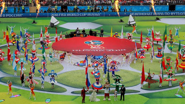 World Cup - Opening Ceremony - Soccer Football - World Cup - Opening Ceremony - Luzhniki Stadium, Moscow, Russia - June 14, 2018   Robbie Williams, Aida Garifullina, former player Ronaldo and World Cup mascot Zabivaka during the opening ceremony   REUTERS/Maxim Shemetov