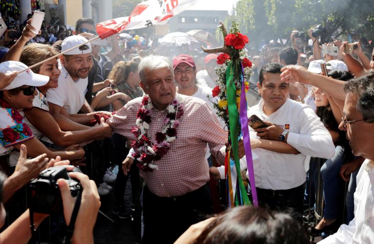 FILE PHOTO: Leftist front-runner Andres Manuel Lopez Obrador of (MORENA) greets supporters in Uruapan - NARCH/NARCH30