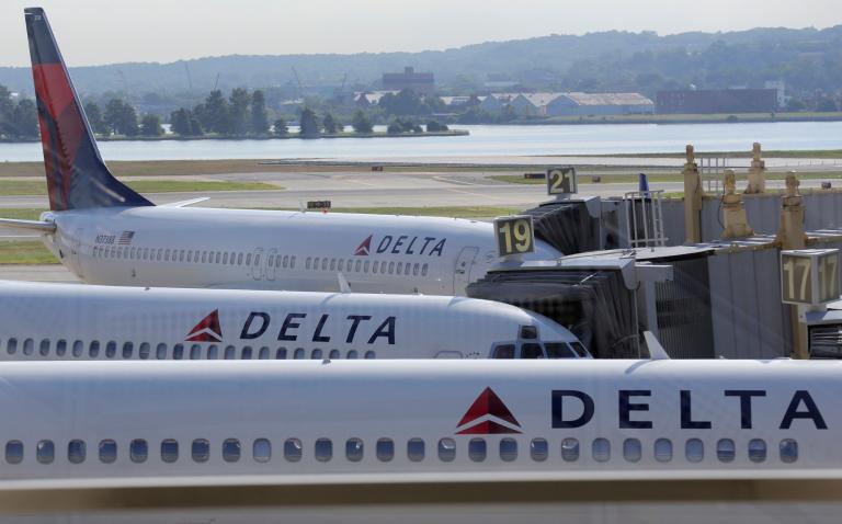 FILE PHOTO: Delta Airlines planes are parked at gates at Ronald Reagan Washington National Airport in Washington - NARCH/NARCH30