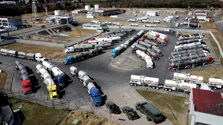 Tanker trucks wait to load gasoline to distribute to Pemex gas stations in El Salto, Jalisco state, due to the shortage of fuel in states such as Hidalgo, Jalisco, Michoacan, Guanajuato, Mexico and Queretaro, Mexico on January 7, 2019. - President Andres Manuel Lopez Obrador recently announced a joint plan with state-run oil company Pemex to tackle fuel theft from pipelines and within the company. (Photo by ULISES RUIZ / AFP)