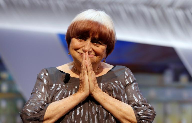 FILE PHOTO: Filmmaker Agnes Varda reacts being awarded with an honorary Palme d