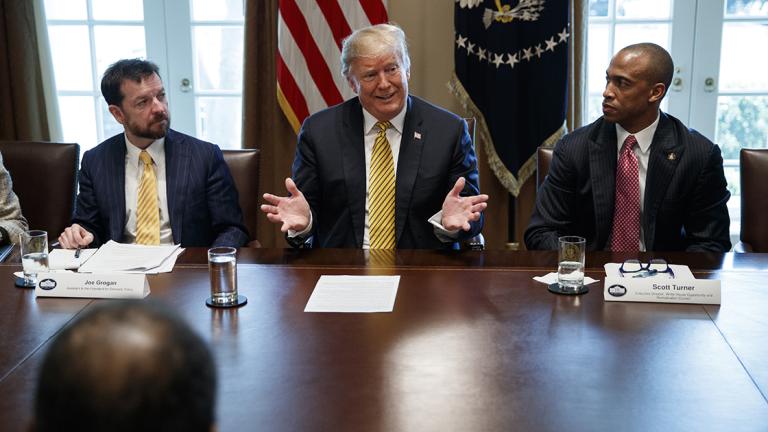 Donald Trump, Scott Turner, Joe Grogan - Joe Grogan, Assistant to the President for Domestic Policy and Vice Chair of the White House Opportunity and Revitalization Council, left, and Scott Turner, Executive Director of the White House Opportunity and Revitalization Council, right, listen as President Donald Trump speaks during the White House Opportunity and Revitalization Council meeting in the Cabinet Room of the White House, Thursday, April 4, 2019, in Washington. (AP Photo/Evan Vucci)