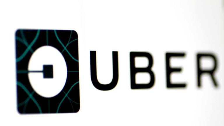 FILE PHOTO - The Uber logo is seen on a screen in Singapore - FILE PHOTO - The Uber logo is seen on a screen in Singapore August 4, 2017. REUTERS/Thomas White/File Picture - NARCH/NARCH30