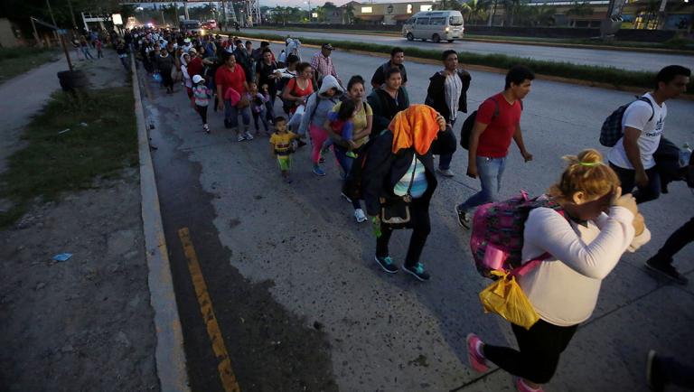 A large group of Hondurans fleeing poverty and violence, move in a caravan toward the United States, in San Pedro Sula