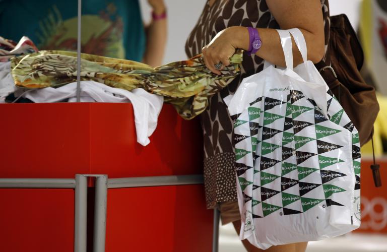 A customer searches for clothes inside an El Corte Ingles department store in Madrid