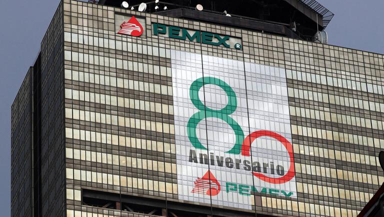 A sign to commemorate the 80th anniversary of the founding of state-owned enterprise Pemex is seen on the facade of its headquarters in Mexico City, Mexico