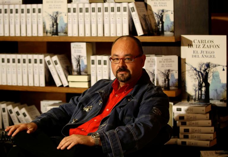 FILE PHOTO: Spanish writer Carlos Ruiz Zafon attends a photo call before the presentation on his new book titled "El juego del Angel", or The game of the Angel, at the Liceu theater