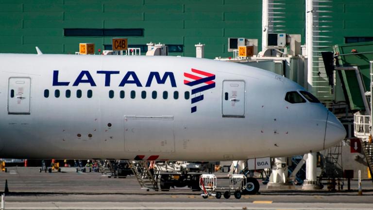 A Latam airlines plane sits on the tarmac at Santiago International Airport, in Santiago on May 26,2020, during the new coronavirus, COVID-19, pandemic. - Latin America's biggest airline, the Brazilian-Chilean group LATAM, filed for bankruptcy in the US, according to a statement on May 25, 2020. Shares in Latin America's largest airline plunged 35 percent on the Santiago stock exchange following  the filing for bankruptcy. (Photo by Martin BERNETTI / AFP)