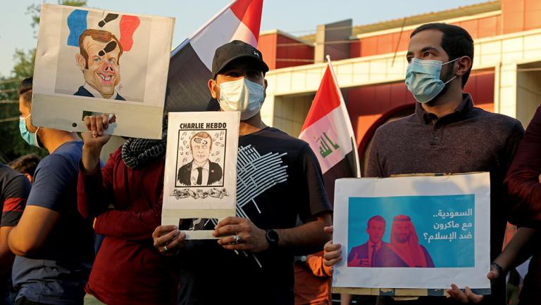 Iraqi people gather during a protest against the publications of a cartoon of Prophet Mohammad in France and French President Emmanuel Macron