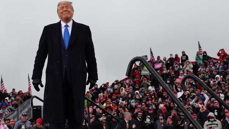 U.S. President Trump holds a campaign event in the rain at Capital Region International Airport in Lansing, Michigan