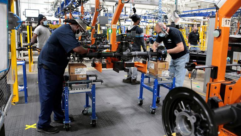 FILE PHOTO: Dana Inc. assembly technicians wear face masks as they assemble axles for automakers, amid the coronavirus (COVID-19) outbreak, in Toledo