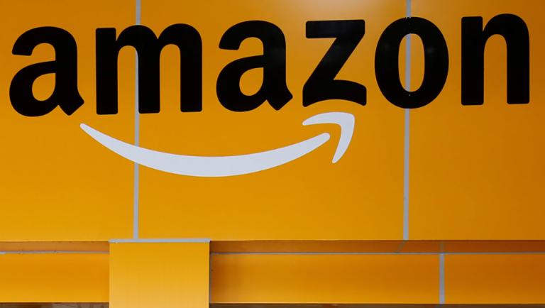 An employee of Amazon walks through a turnstile gate inside an Amazon Fulfillment Centre (BLR7) on the outskirts of Bengaluru, India, September 18, 2018. REUTERS/ Abhishek N. Chinnappa