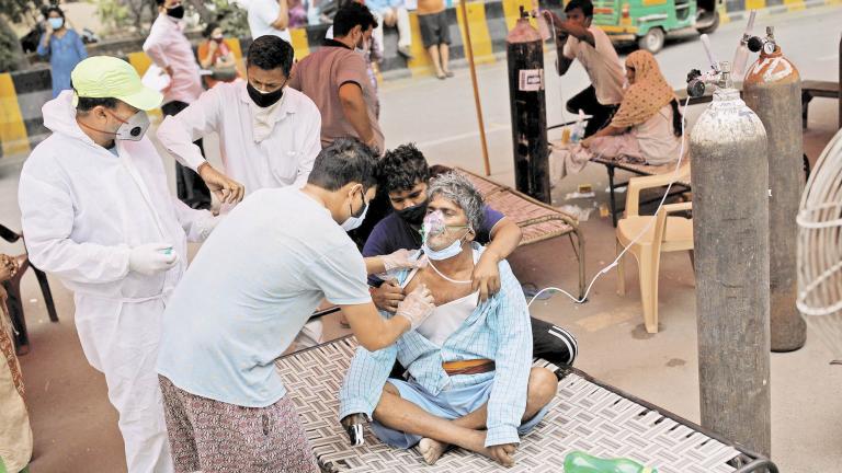 Nanhe Pal, 52, receives oxygen support for free at a Gurudwara amidst the spread of coronavirus disease (COVID-19), in Ghaziabad