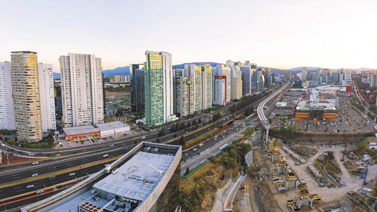 Mexico City - march 10, 2019: Panoramic aerial view of the huge office and apartment skyscrapers on the famous Santa Fe Avenue and the beautiful Mexicana Park