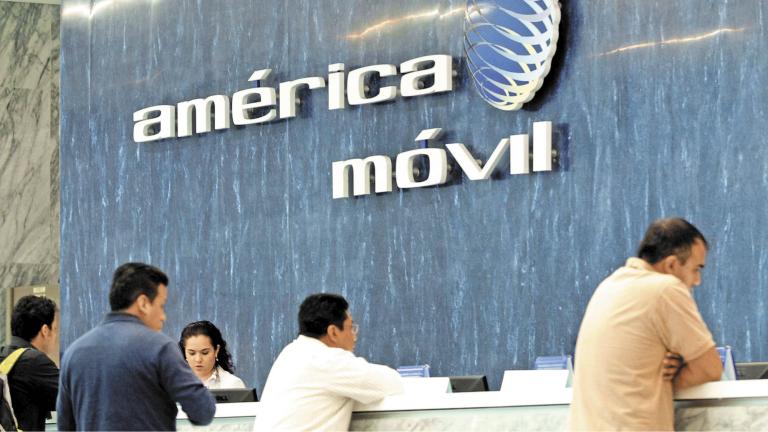 FILE PHOTO: The logo of America Movil in the reception area of the company's corporate offices in Mexico City February 13, 2013.  REUTERS/Edgard Garrido/File Photo-NARCH/NARCH30