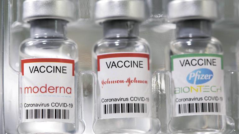 FILE PHOTO: Vials labelled "Moderna, Johnson & Johnson, Pfizer-BioNTech coronavirus disease (COVID-19) vaccine" are seen in this illustration picture