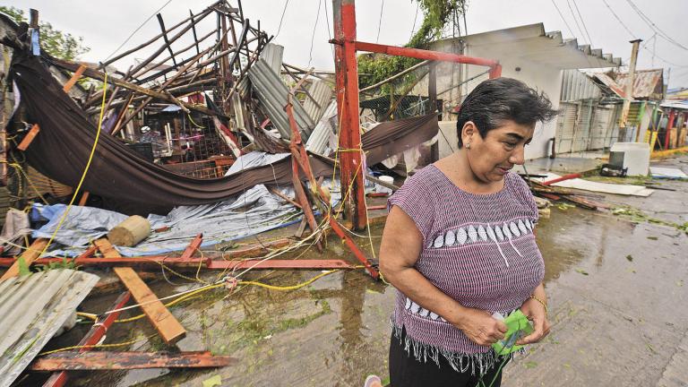 Martha Sanchez reacts while walking in front of her souvenir store that was destroyed when Hurricane Grace slammed into the coast with torrential rains, in Costa Esmeralda, near Tecolutla, Mexico August 21, 2021.   REUTERS/Oscar Martinez