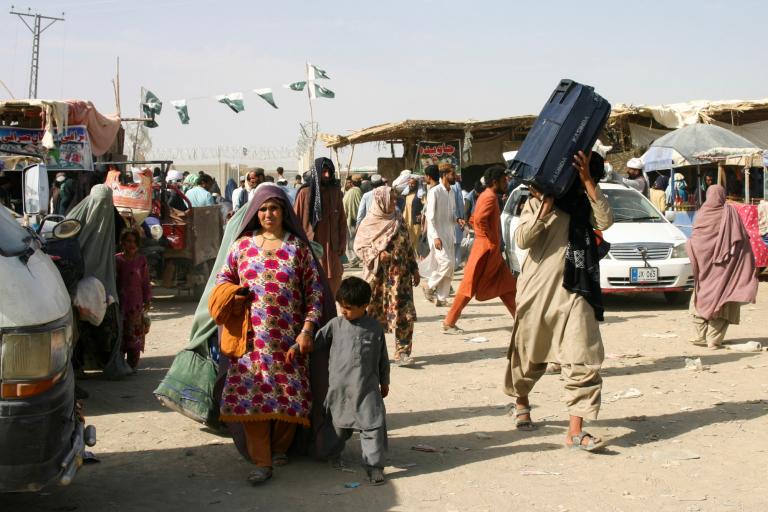 People cross Friendship Gate at the Pakistan-Afghanistan border town of Chaman