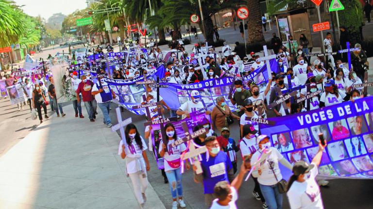 Relatives of victims of femicide hold a march in memory of their loved ones