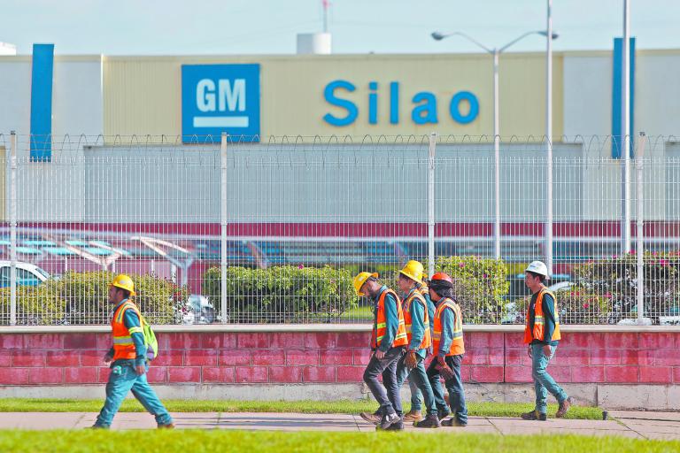 General Motors workers are seen while leaving their shift, outside the GM pickup and transmission plant in Silao, Mexico October 1, 2019. REUTERS/Sergio Maldonado NO RESALES. NO ARCHIVES-NARCH/NARCH30