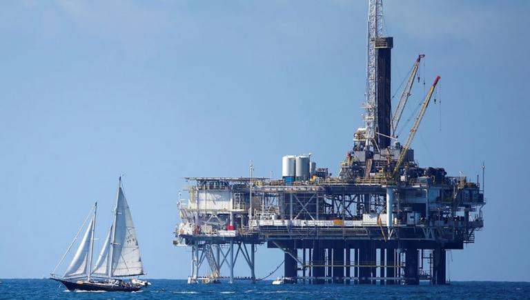 FILE PHOTO: An offshore oil platform is seen in Huntington Beach, California September 28, 2014. Brent oil prices fell more than $2 a barrel to less than $88 on Monday, its lowest since 2010, after key Middle East producers signalled they would keep output high even if that meant lower prices. Brent oil prices have tanked by nearly 25 percent since June as ample supply coincided with weak demand, raising the possibility that the Organization of the Petroleum Exporting countries could cut output.  Picture taken September 28, 2014. REUTERS/Lucy Nicholson/File Photo-NARCH/NARCH30