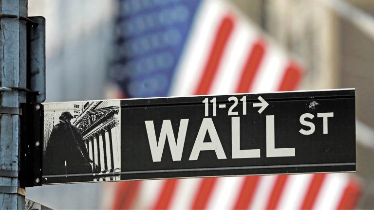 FILE PHOTO: A street sign for Wall Street is seen outside the New York Stock Exchange (NYSE) in New York City, New York, U.S., July 19, 2021. REUTERS/Andrew Kelly/File Photo-NARCH/NARCH30 NARCH/NARCH30