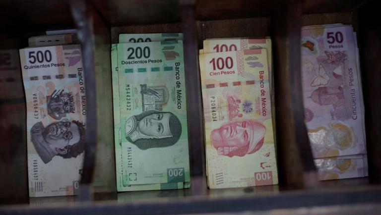 FILE PHOTO: Mexican peso banknotes are pictured at a currency exchange shop in Ciudad Juarez, Mexico November 10, 2017. REUTERS/Jose Luis Gonzalez/File Photo-NARCH/NARCH30