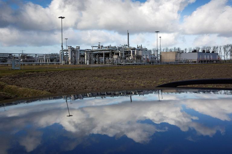 FILE PHOTO: A view of a gas production plant is reflected in the roof of a car in 