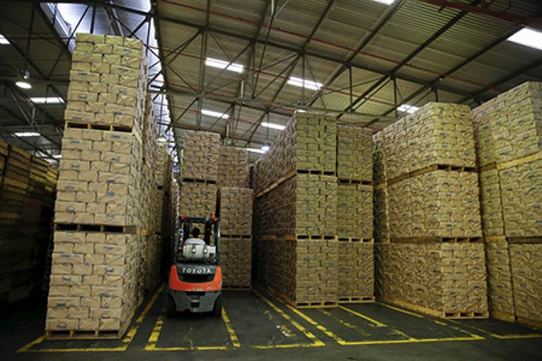 A worker uses a forklift to stack packages of PAN corn flour at an industrial complex of the food company Empresas Polar in Turmero in the state of Aragua, Venezuela October 23, 2015. Socialist Party legislators on Wednesday asked state prosecutors to investigate Venezuela's billionaire businessman Lorenzo Mendoza and Harvard economist Ricardo Hausmann for alleged crimes including