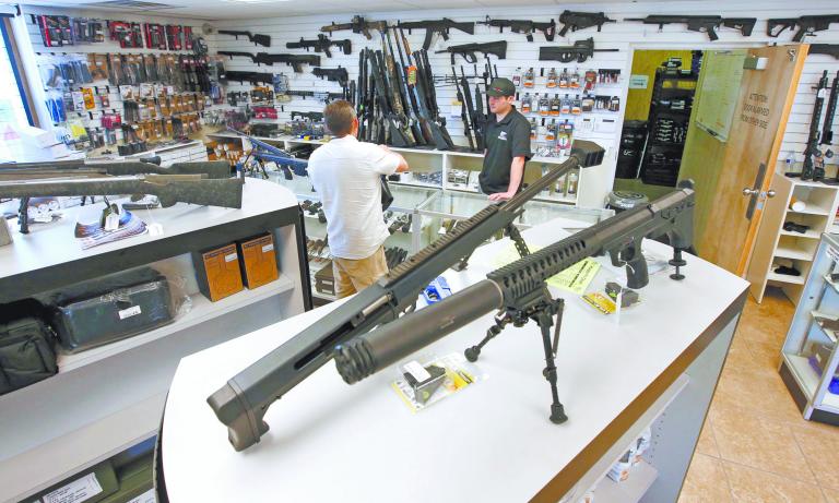 Weapons sit on display for sale at the