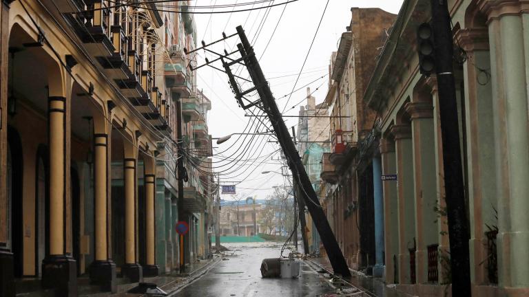 A downed pole is seen on the street in the aftermath of Hurricane Ian's passage through Pinar del Rio, Cuba, September 27, 2022. REUTERS/Alexandre Meneghini