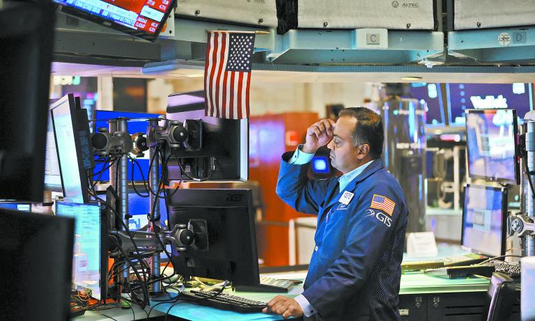 A trader works on the trading floor at the New York Stock Exchange (NYSE) in Manhattan, New York City, U.S., September 13, 2022. REUTERS/Andrew Kelly