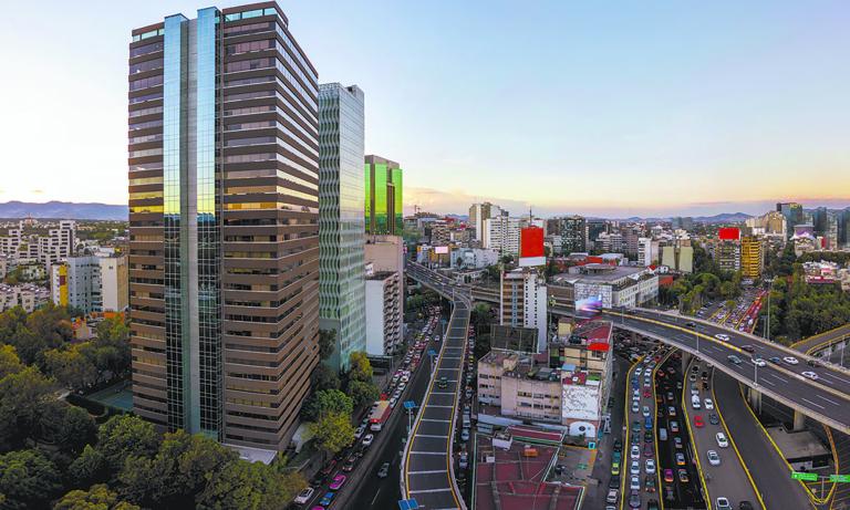 Mexico City - october 23, 2018: Panoramic aerial view of busy avenues full of cars and surrounded by buildings near the Lomas de Chapultepec neighborhood