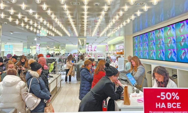 Customers shop at an H&M store in Moscow