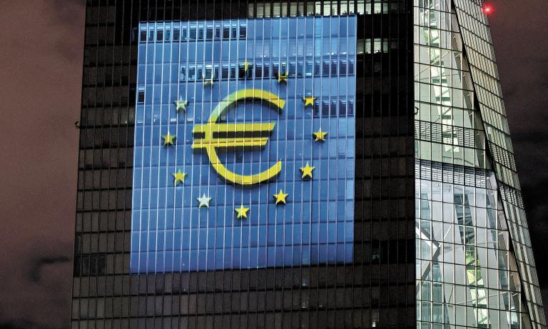 FILE PHOTO: A symphony of light consisting of bars, lines and circles in blue and yellow, the colours of the European Union, illuminates the south facade of the European Central Bank (ECB) headquarters in Frankfurt, Germany, December 30, 2021.   REUTERS/Wolfgang Rattay/File Photo-NARCH/NARCH30