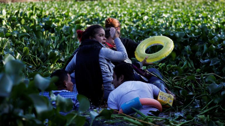 Migrants seeking asylum in the United States cross the Rio Bravo river, in Matamoros