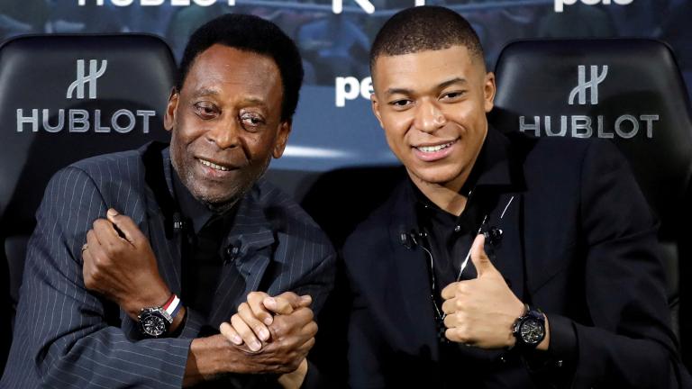 FILE PHOTO: French soccer player Kylian Mbappe and Brazilian soccer legend Pele meet in Paris