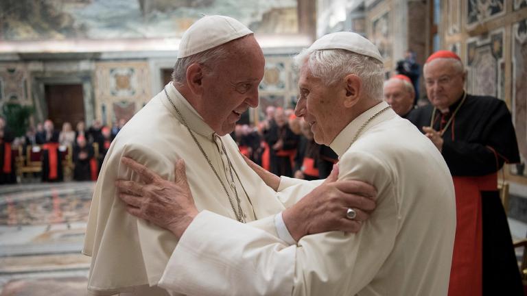 FILE PHOTO: Former pope Benedict is greeted by Pope Francis during a ceremony to mark his 65th anniversary of ordination to the priesthood at the Vatican