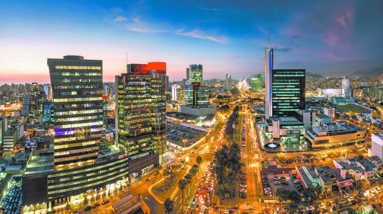 LIMA, PERU: Panoramic view of skyline in San Isidro district at blue time.