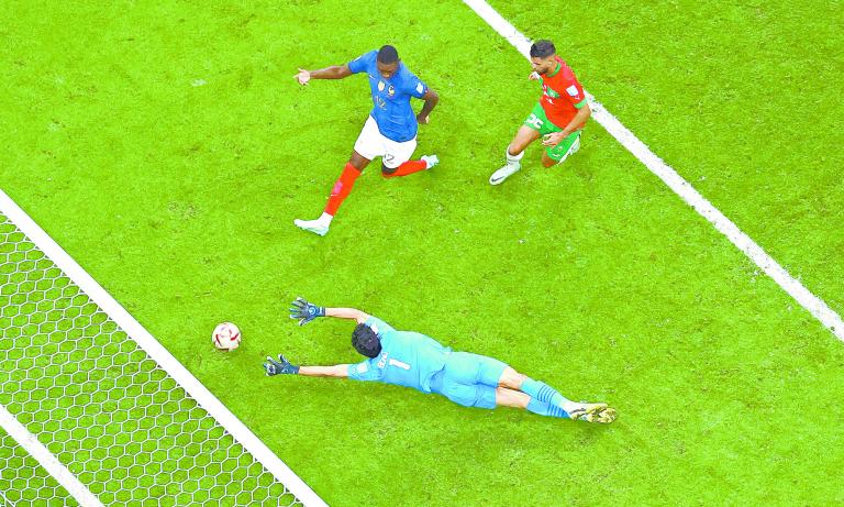 Soccer Football - FIFA World Cup Qatar 2022 - Semi Final - France v Morocco - Al Bayt Stadium, Al Khor, Qatar - December 14, 2022France's Randal Kolo Muani scores their second goal past Morocco's Yassine Bounou REUTERS/Fabrizio Bensch     TPX IMAGES OF THE DAY