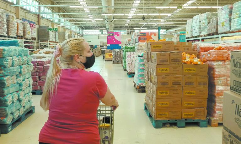 Buenos Aires, Argentina- november 29, 2020: Woman with face mask in the supermarket during coronavirus.