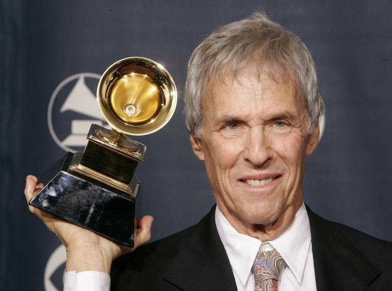 FILE PHOTO: Composer Burt Bacharach poses with the Grammy award he won for best pop instrumental album for