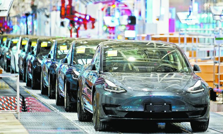 FILE PHOTO: Tesla China-made Model 3 vehicles are seen during a delivery event at the carmaker's factory in Shanghai, China January 7, 2020. REUTERS/Aly Song/File Photo-NARCH/NARCH30 NARCH/NARCH30 NARCH/NARCH30