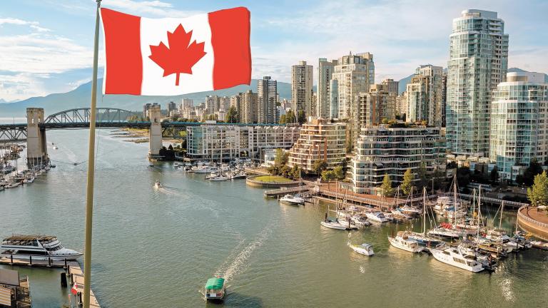 National Canadian Flag with Modern Downtown City in Background during Sunset. Taken in False Creek, Vancouver, British Columbia, Canada. Aerial Composite