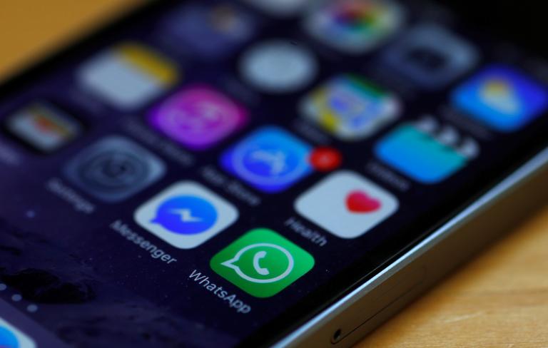 WhatsApp and Facebook messenger icons are seen on an iPhone in Manchester , Britain.